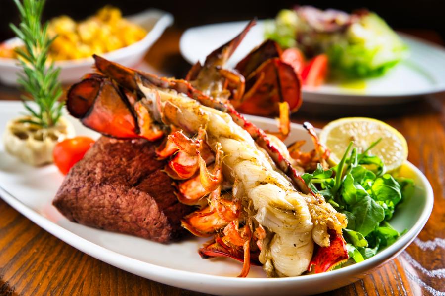 The AAA Four Diamond A Land Remembered's succulent Lobster Tail paired with Chateaubriand, Wedge Salad and Lobster Mac 'n Cheese.